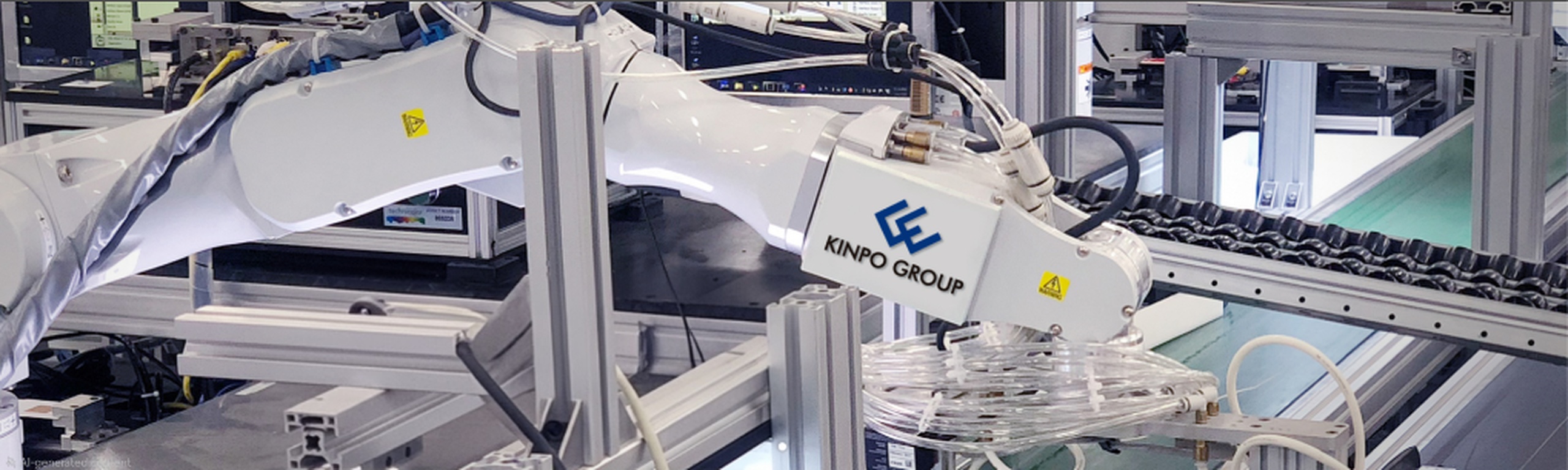 KINPO GROUP automated manufacturing: robotic arms on an assembly line
